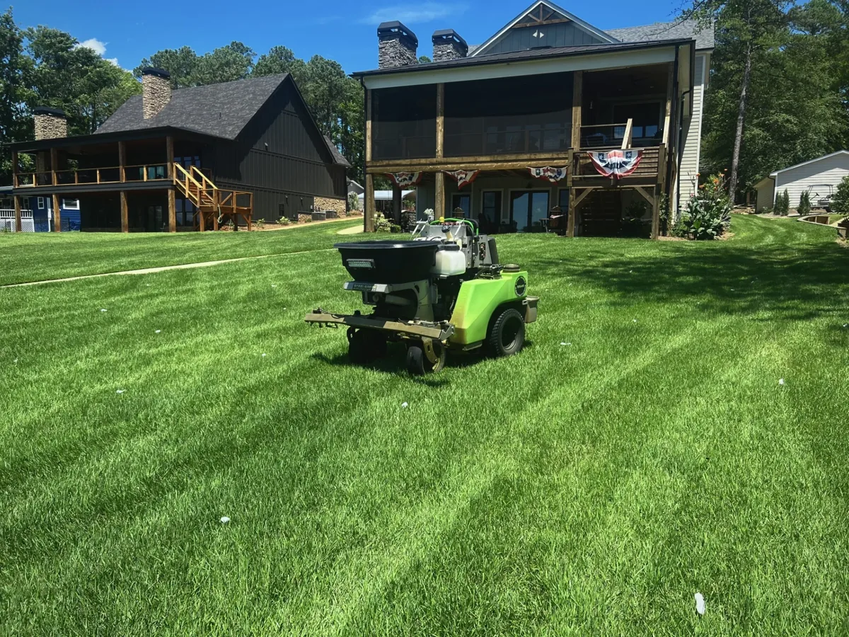 Pro Turf lawn treatment equipment on a green residential lawn
